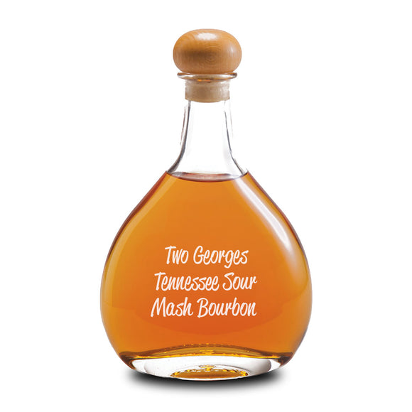 Bottle of Two Georges Tennessee Sour Mash Bourbon with a wooden cap on a white background